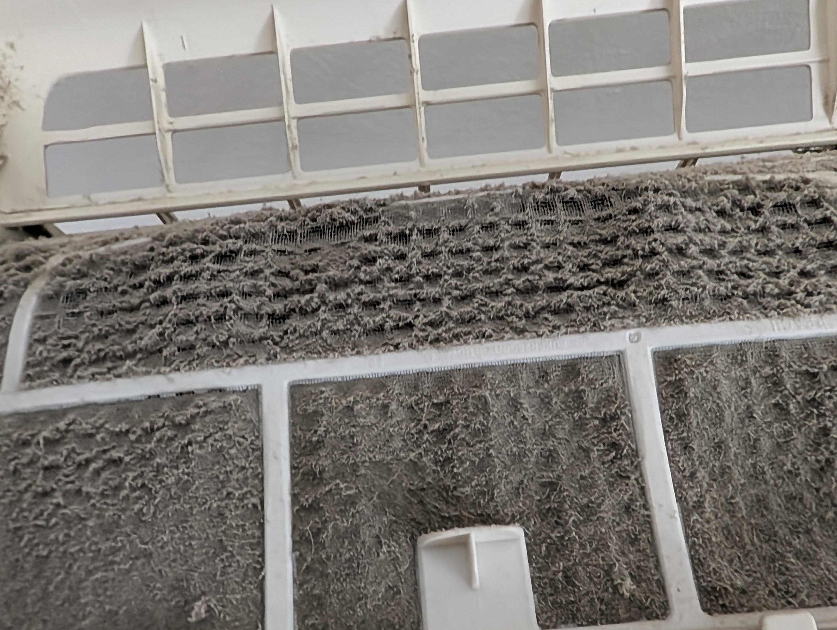 Second close view of the same filter, mesh completely blocked by dust