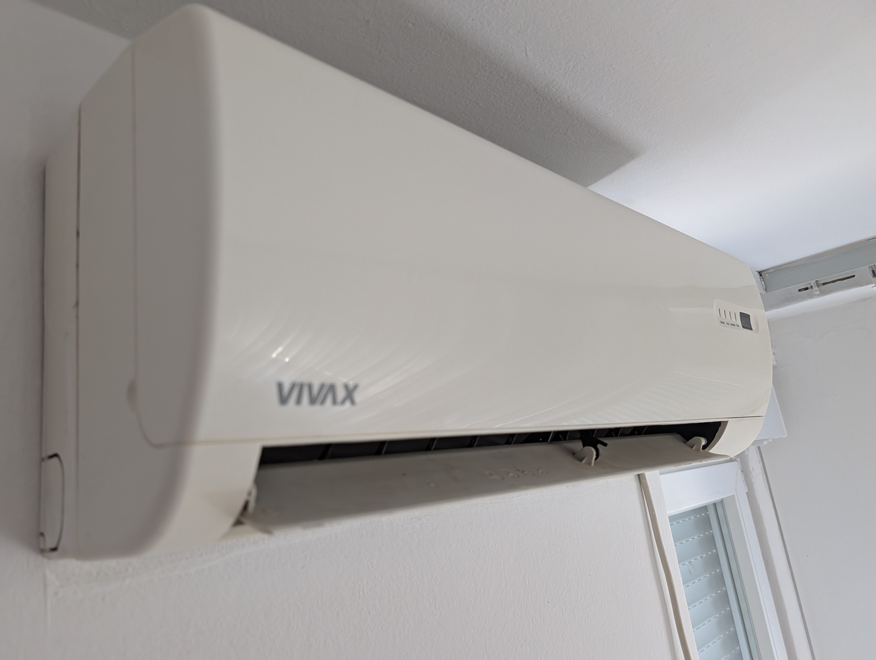 Wall-mounted VIVAX split-system air conditioner in the apartment